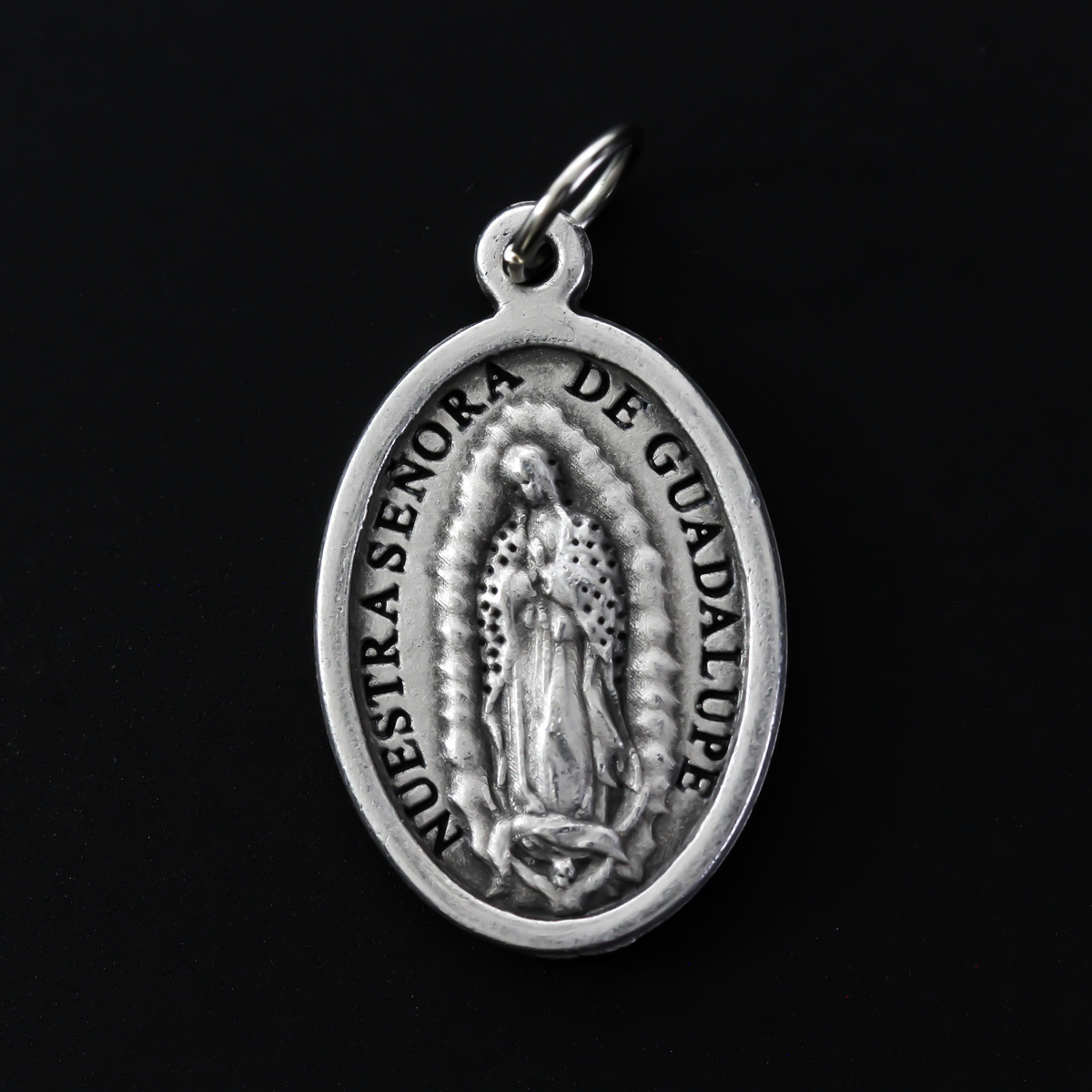 Our Lady of Guadalupe medal with the Divine Mercy of Jesus on the backside.