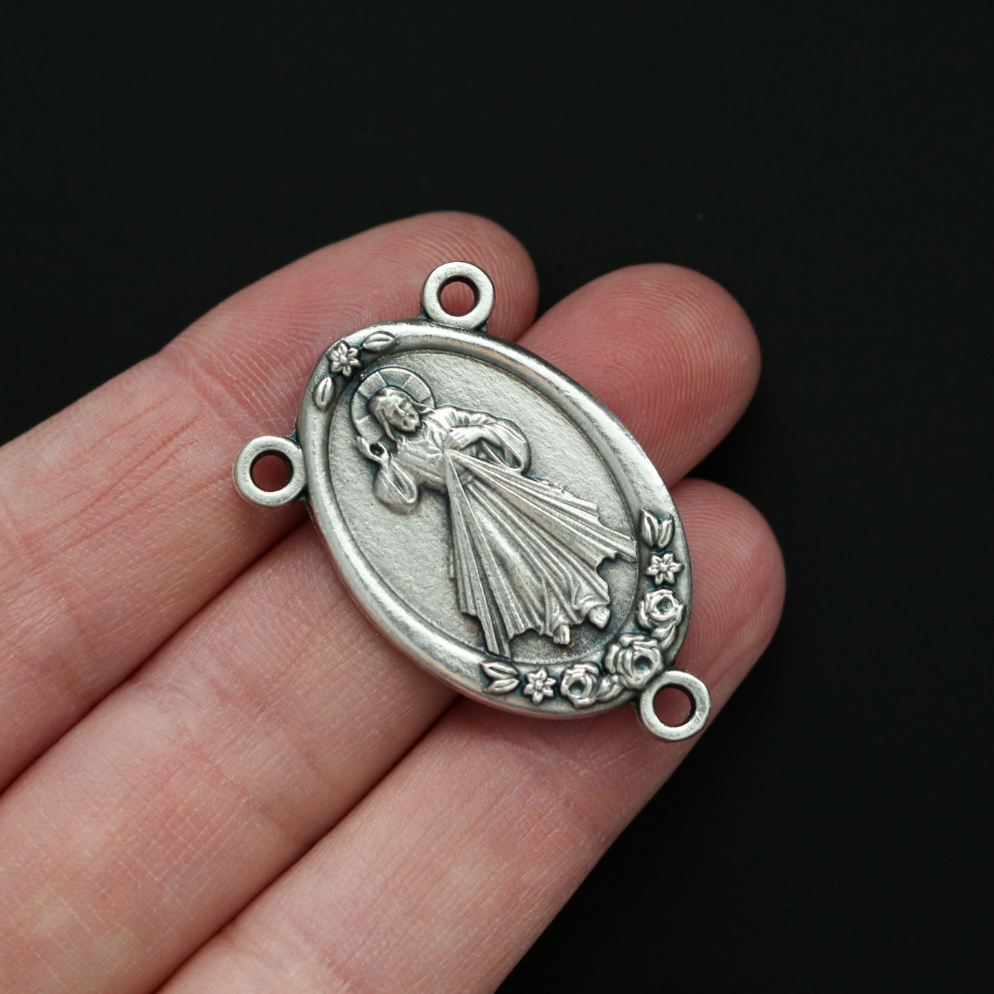 Large Rosary centerpiece that features Our Lady of Guadalupe on the front and the Divine Mercy of Jesus on the back