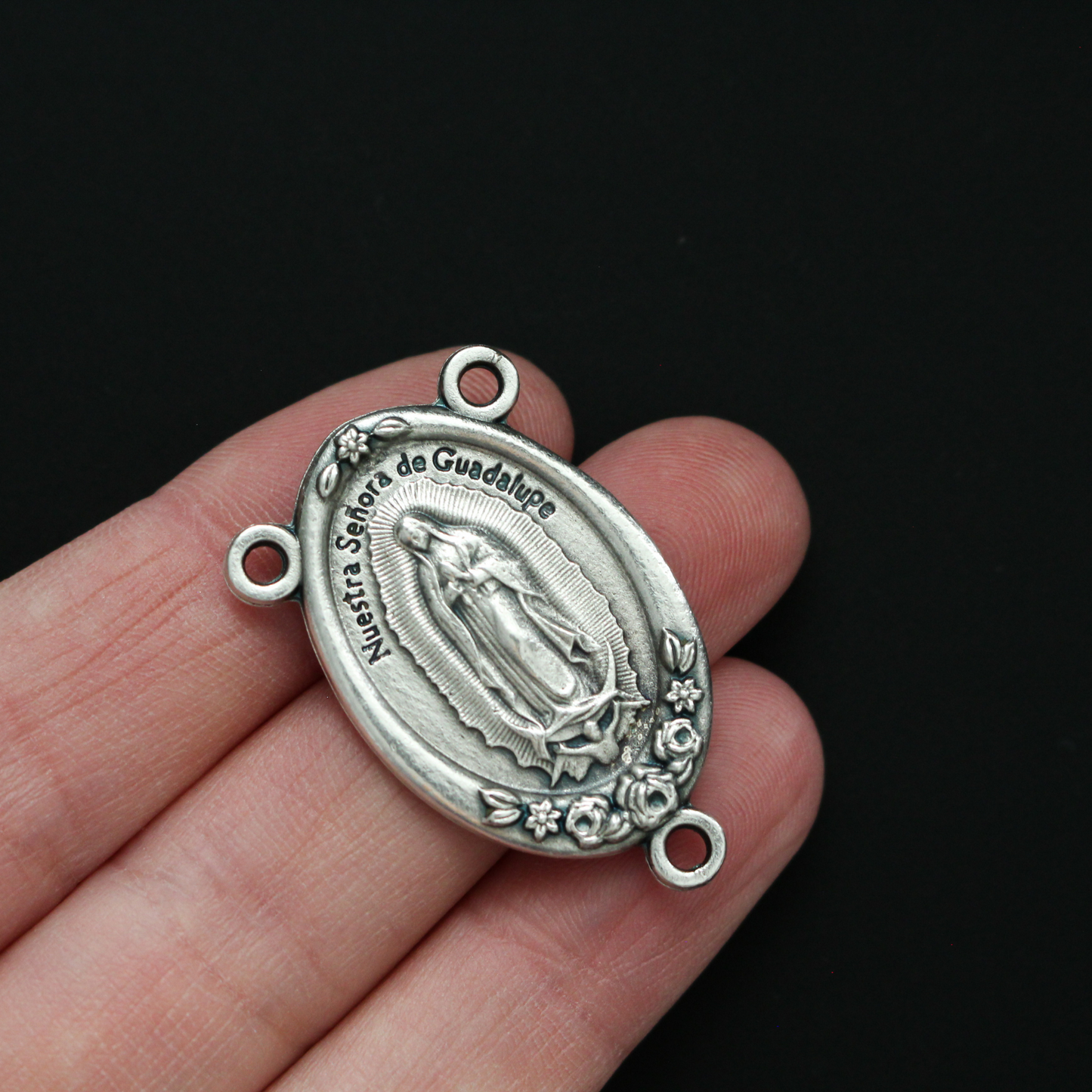 Large Rosary centerpiece that features Our Lady of Guadalupe on the front and the Divine Mercy of Jesus on the back