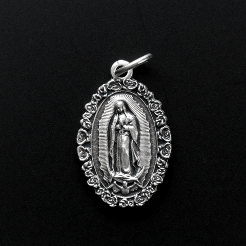 Our Lady of Guadalupe medal with a rose border. The reverse side is marked "Nuestra Senora de Guadalupe"