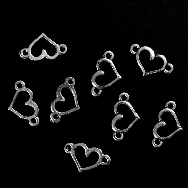 Hollow heart connector links that are sold in packs of 20 pieces.