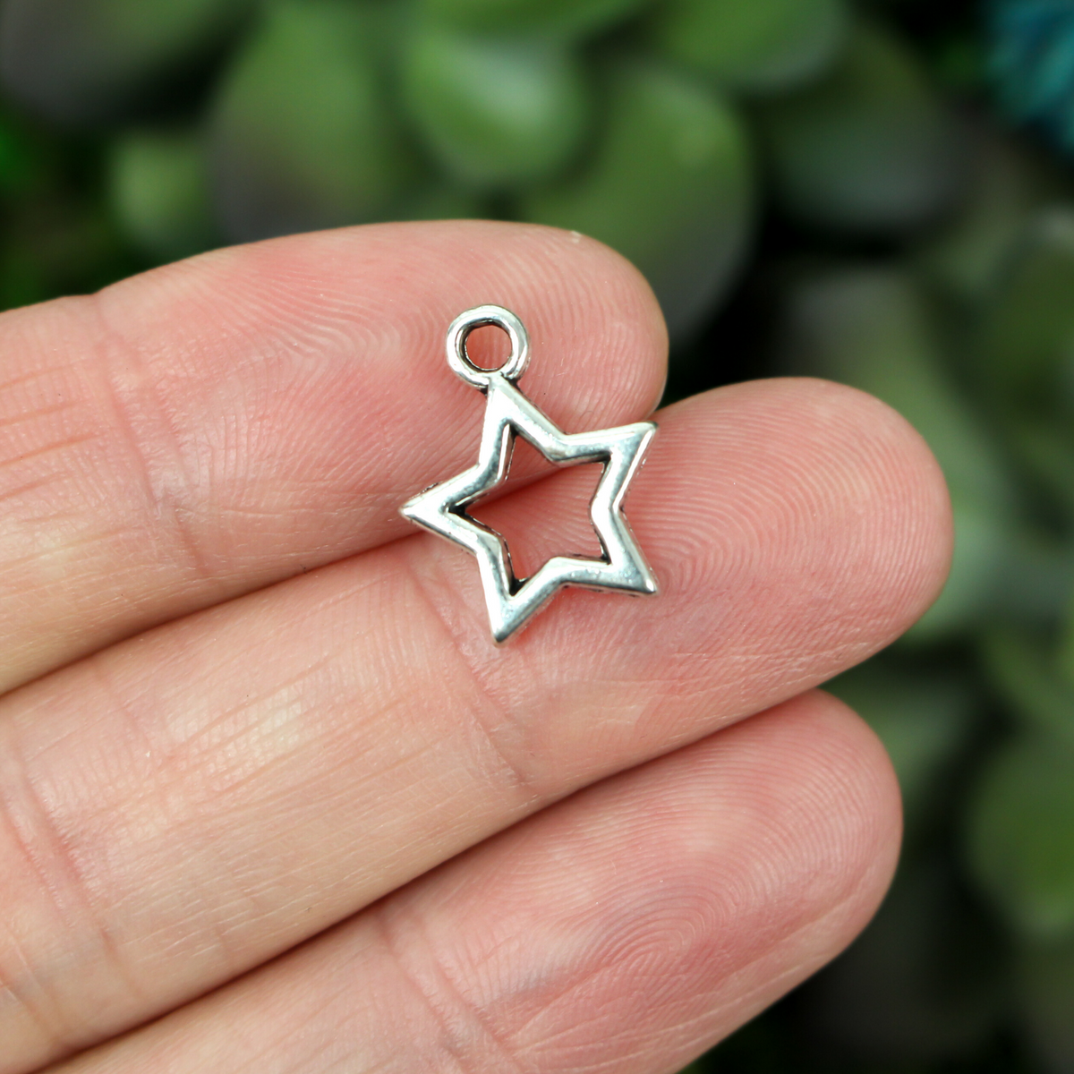 silver tone hollow star charm