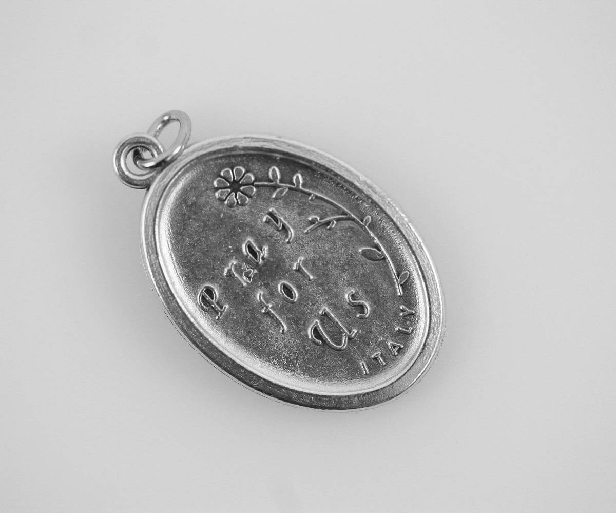 die cast silver saint clare one inch oval medal