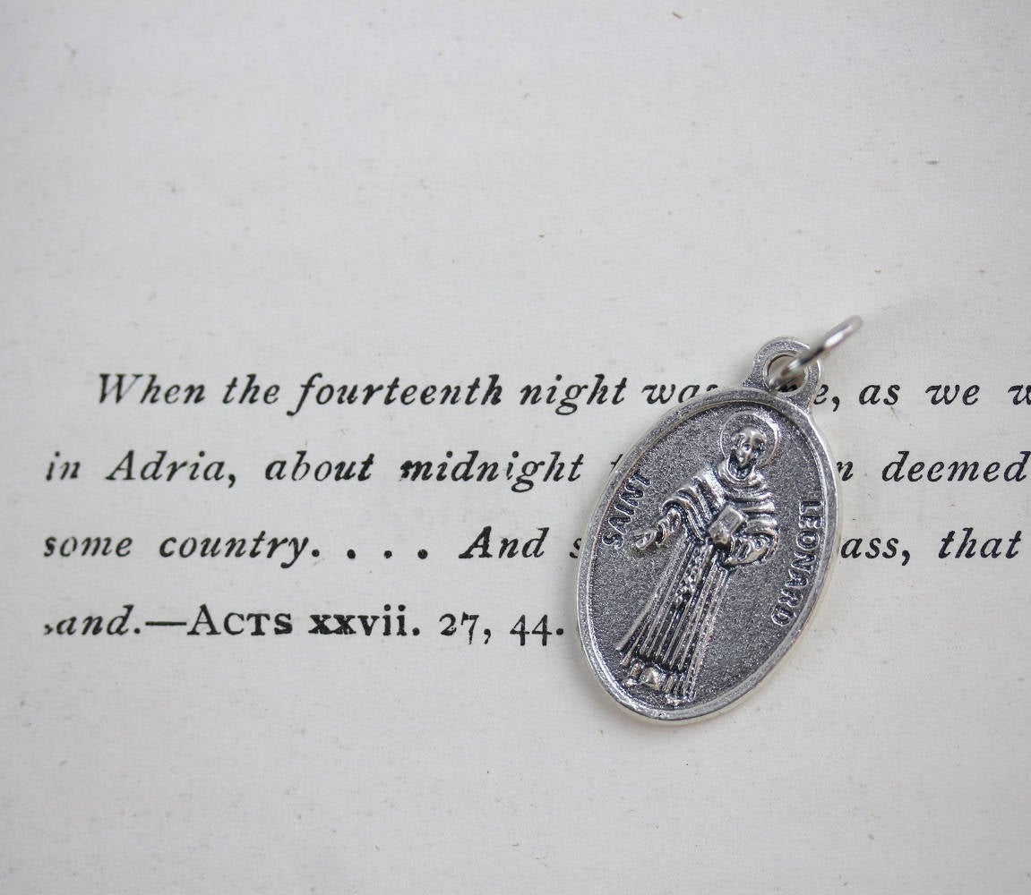 die cast silver medal depicting patron saint leonard