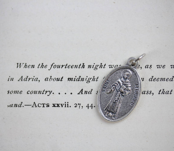 die cast silver medal depicting patron saint leonard