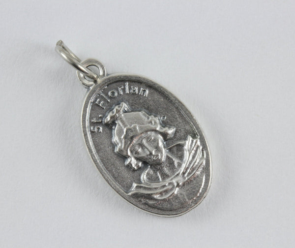 die cast silver medal depicting patron saint florian