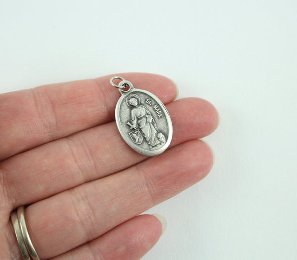 die cast silver medal depicting patron saint mark one inch oval