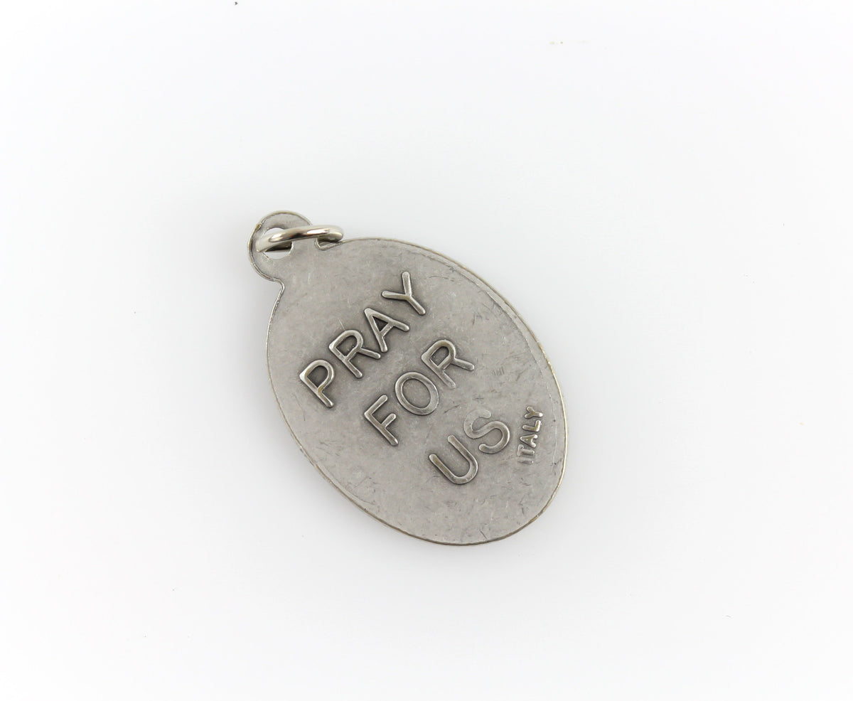 die cast silver medal inscribed with pray for us