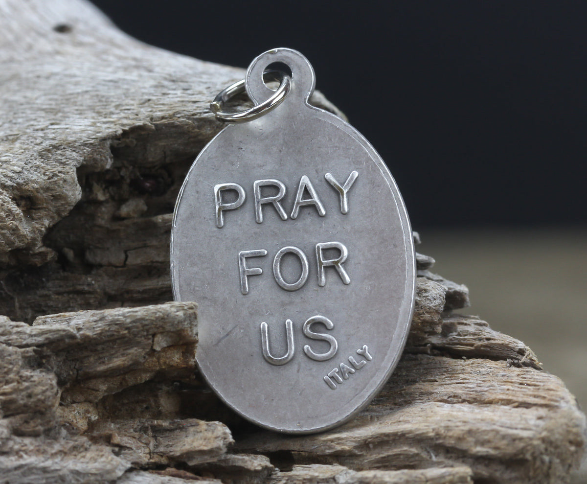 die cast silver medal depicting patron saint edward