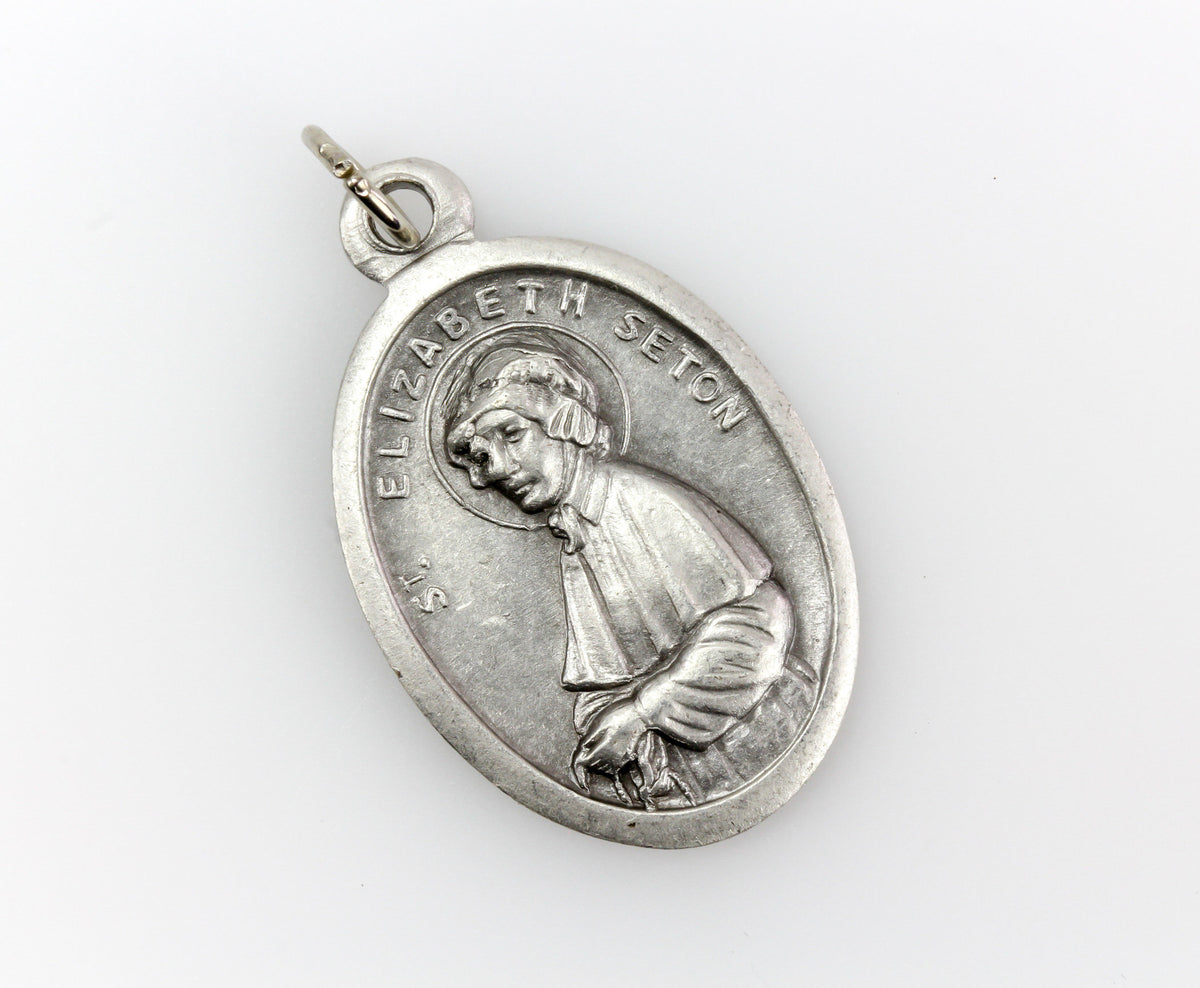 die cast silver medal depicting patron saint elizabeth ann seton