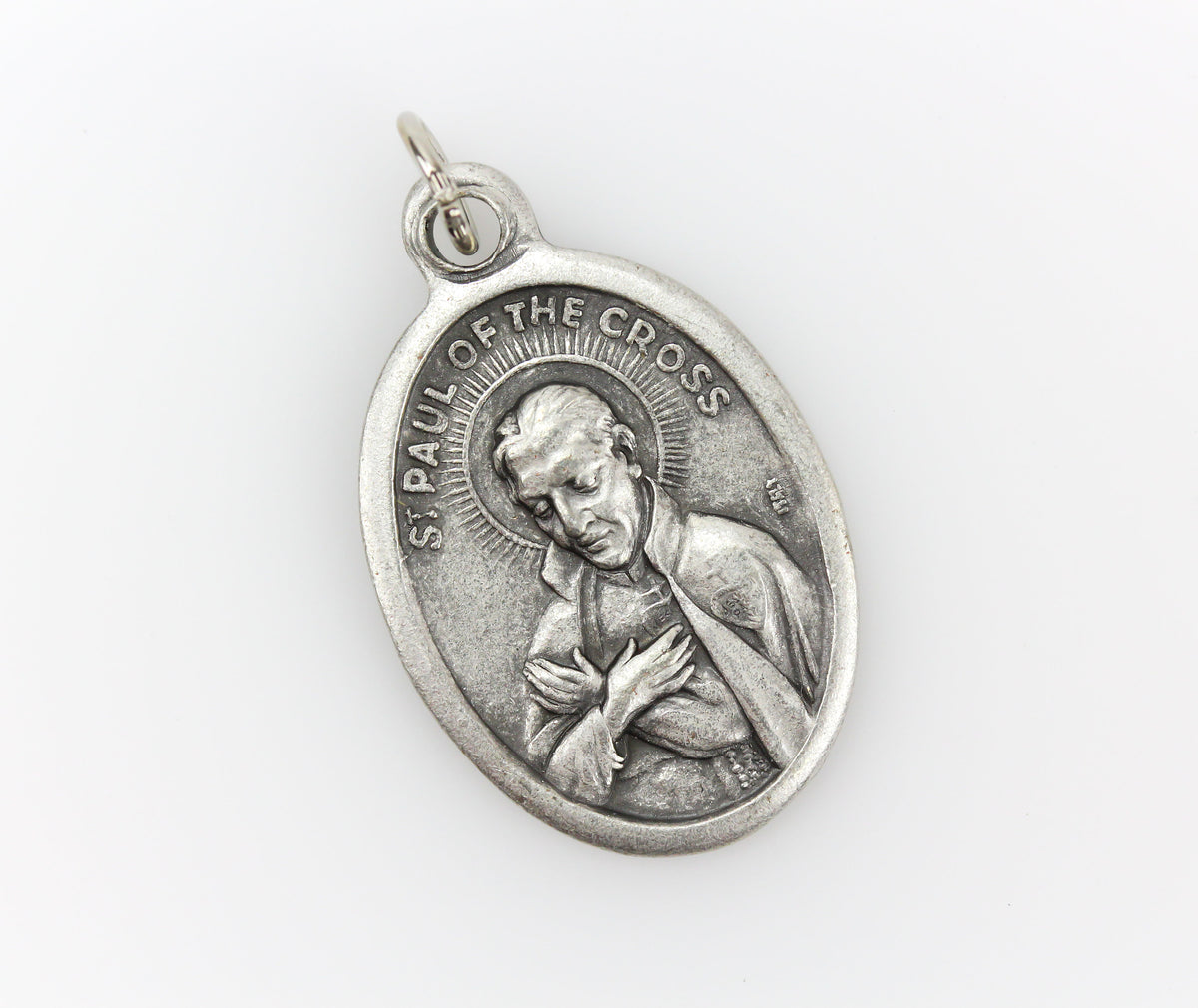 saint paul of the cross die cast silver tone one inch oval medal