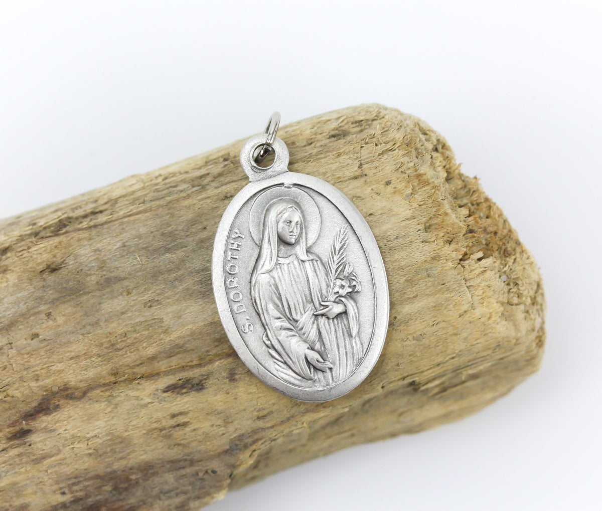 die cast silver medal depicting patron saint dorothy one inch oval