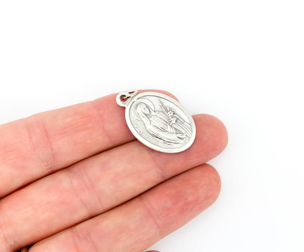 die cast silver medal depicting patron saint dorothy one inch oval
