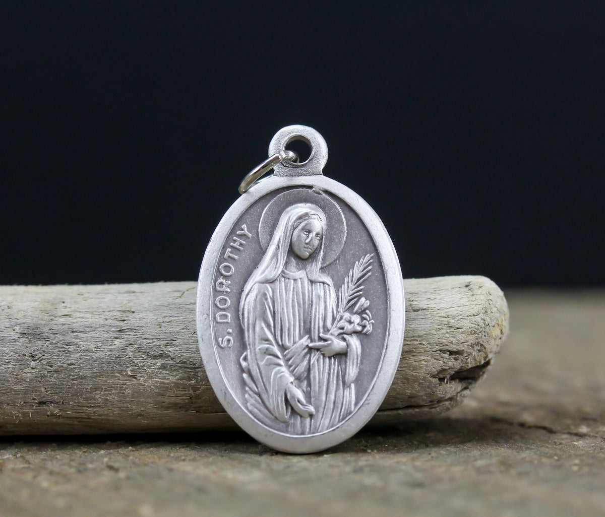 die cast silver medal depicting patron saint dorothy one inch oval