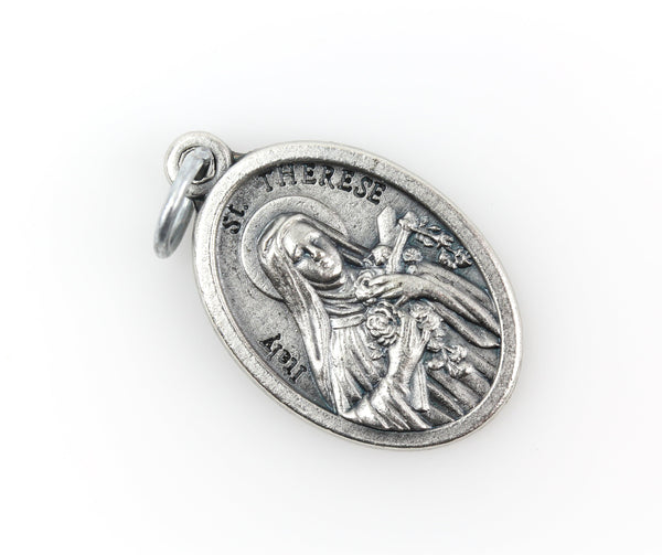 saint therese die-cast silver one inch oval medal