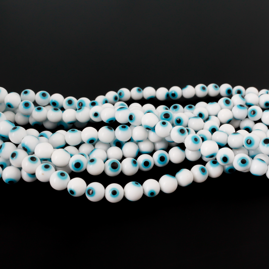 Handmade lampwork glass beads featuring the all seeing evil eye. The beads are white with a light sky blue iris and black pupil, 6mm round