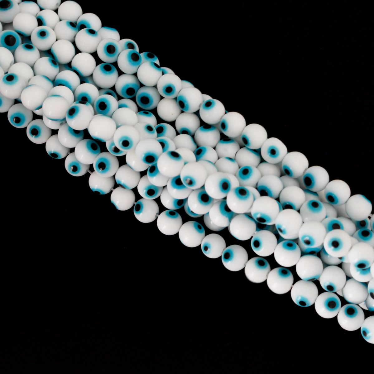 Handmade lampwork glass beads featuring the all seeing evil eye. The beads are white with a light sky blue iris and black pupil, 6mm round