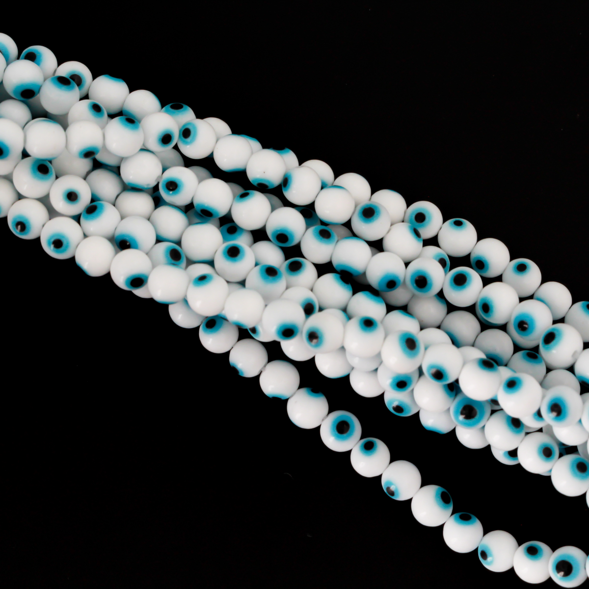 Handmade lampwork glass beads featuring the all seeing evil eye. The beads are white with a light sky blue iris and black pupil, 6mm round