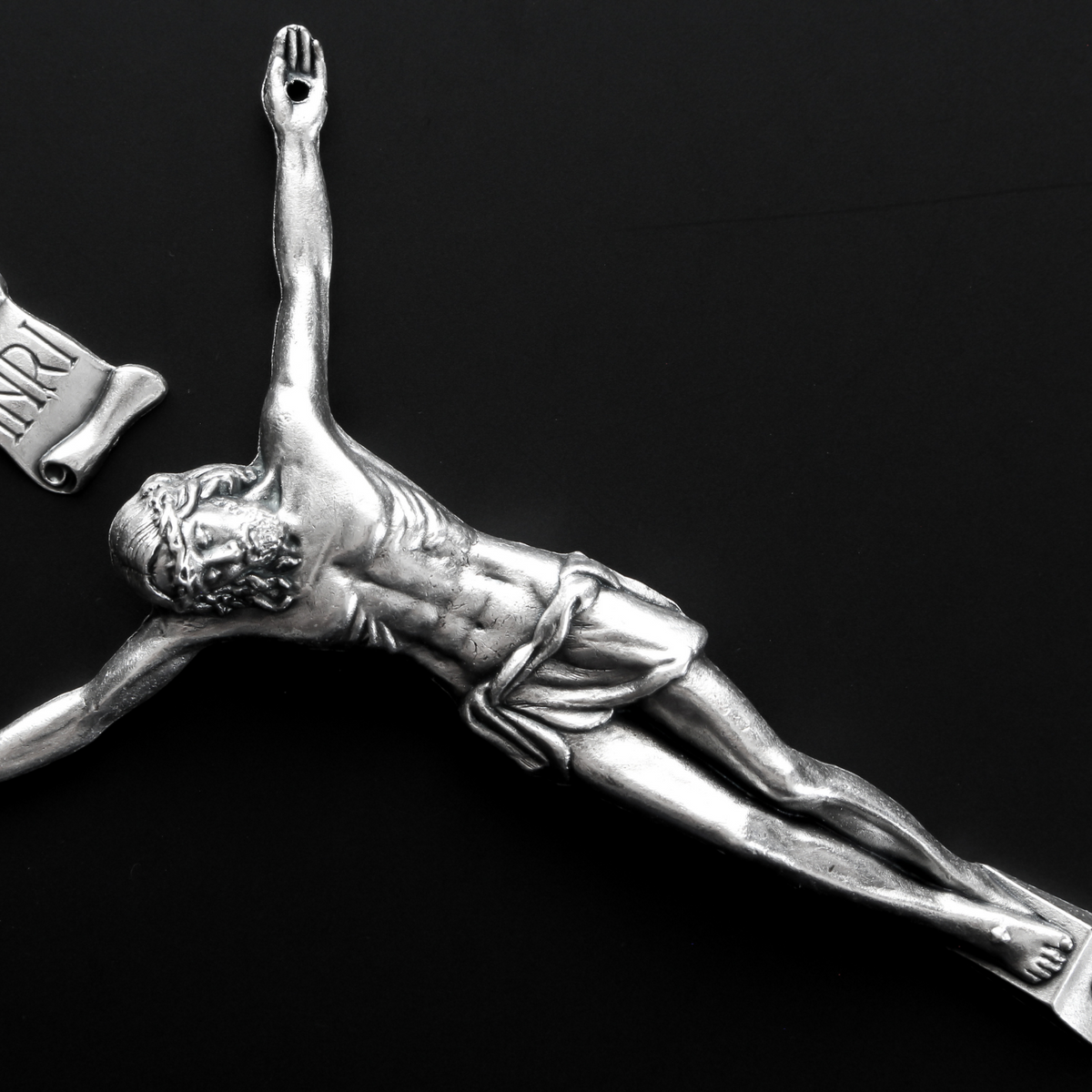 4" corpus that comes with an INRI scroll that can be attached to a cross using the pre-drilled 2mm holes