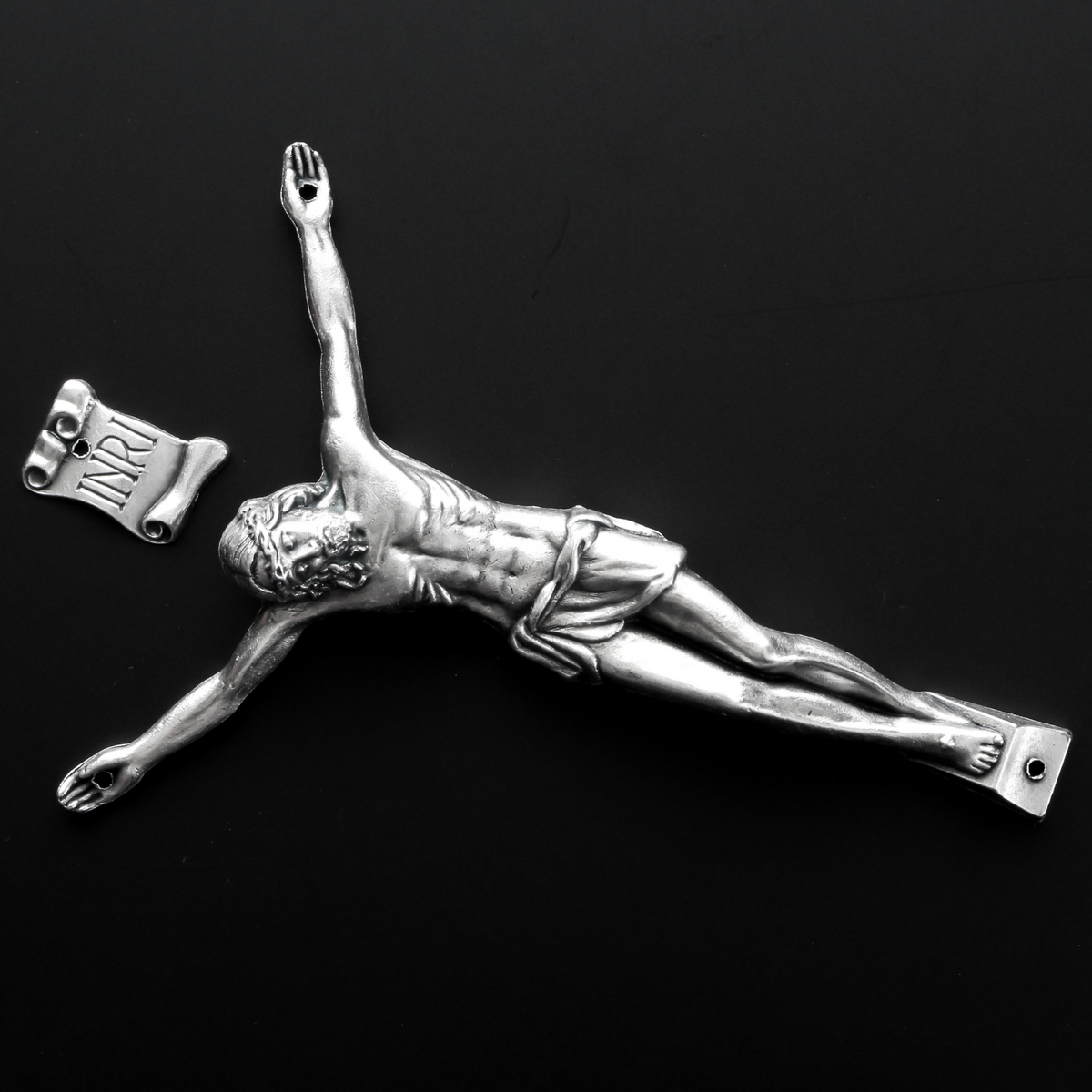 4" corpus that comes with an INRI scroll that can be attached to a cross using the pre-drilled 2mm holes