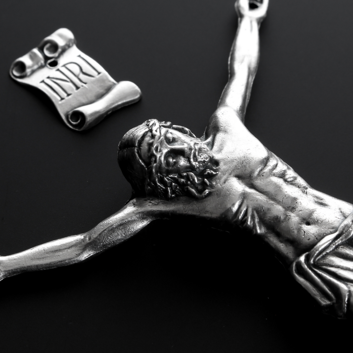 4" corpus that comes with an INRI scroll that can be attached to a cross using the pre-drilled 2mm holes