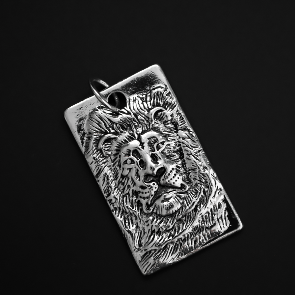 Large Rectangle pendant that depicts a 3D a lion face, 1.75 inches long