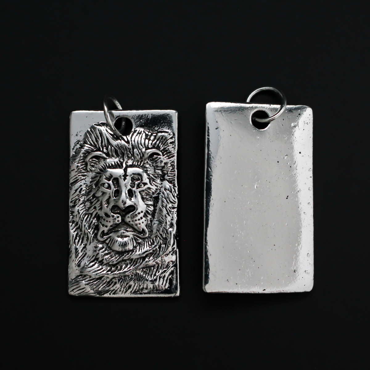 Large Rectangle pendant that depicts a 3D a lion face, 1.75 inches long