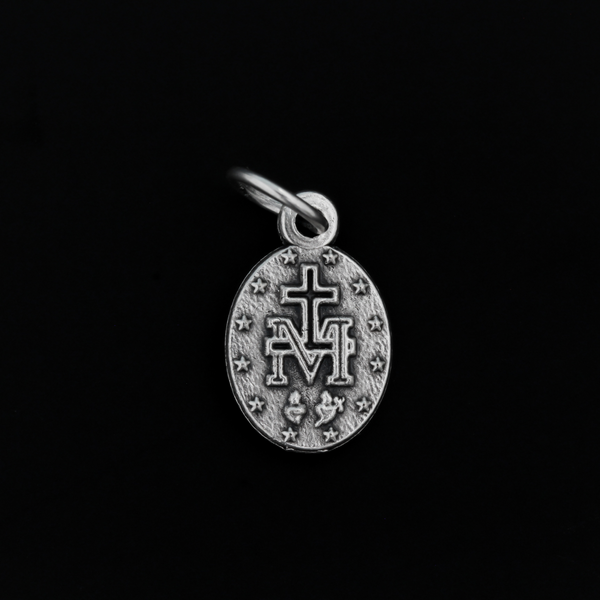 This is a small, beautifully detailed version of the Miraculous Medal in Latin. Measuring 1/2 inch in height