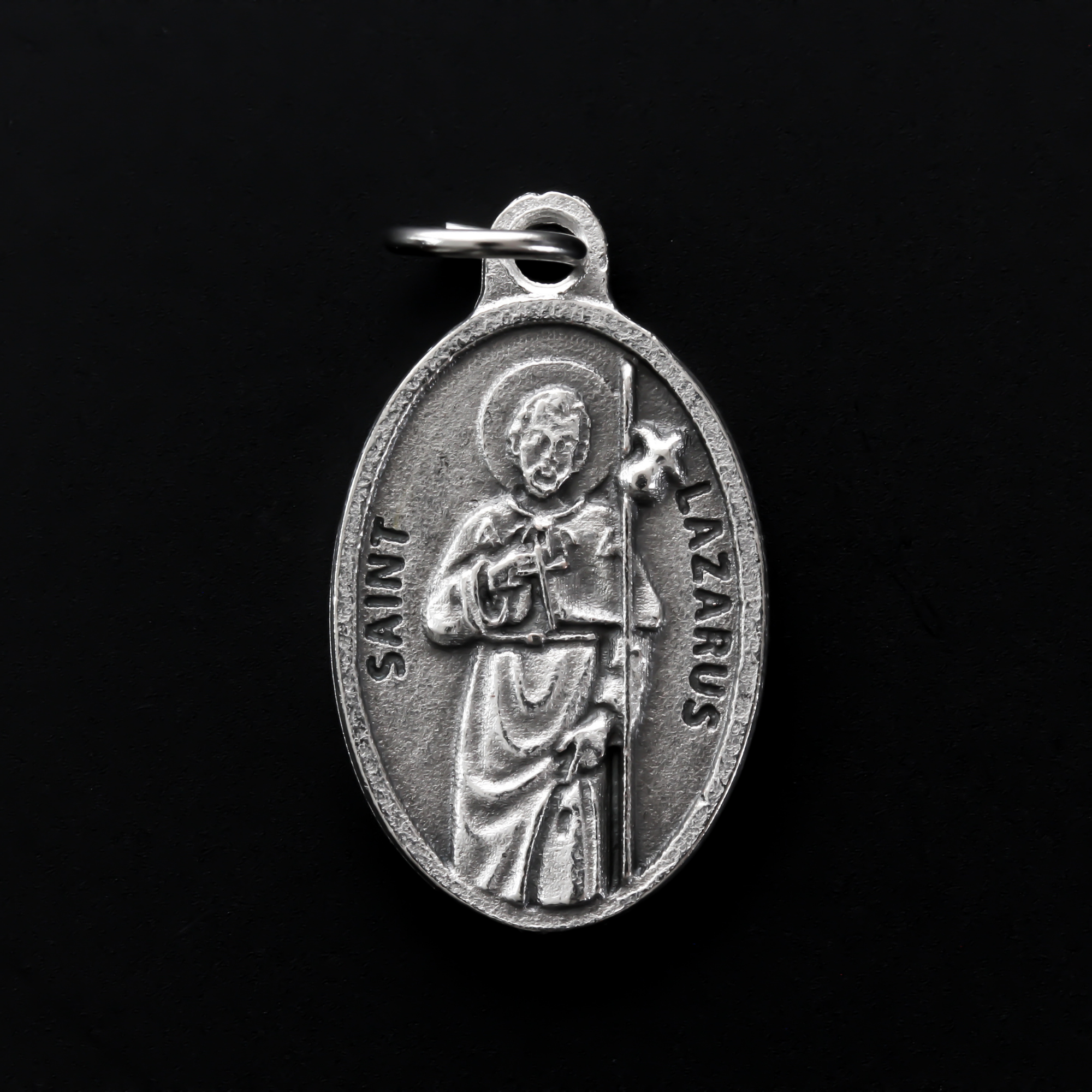 Saint Lazarus of Bethany oval medal that depicts the saint on the front and "Pray For Us" on the back.