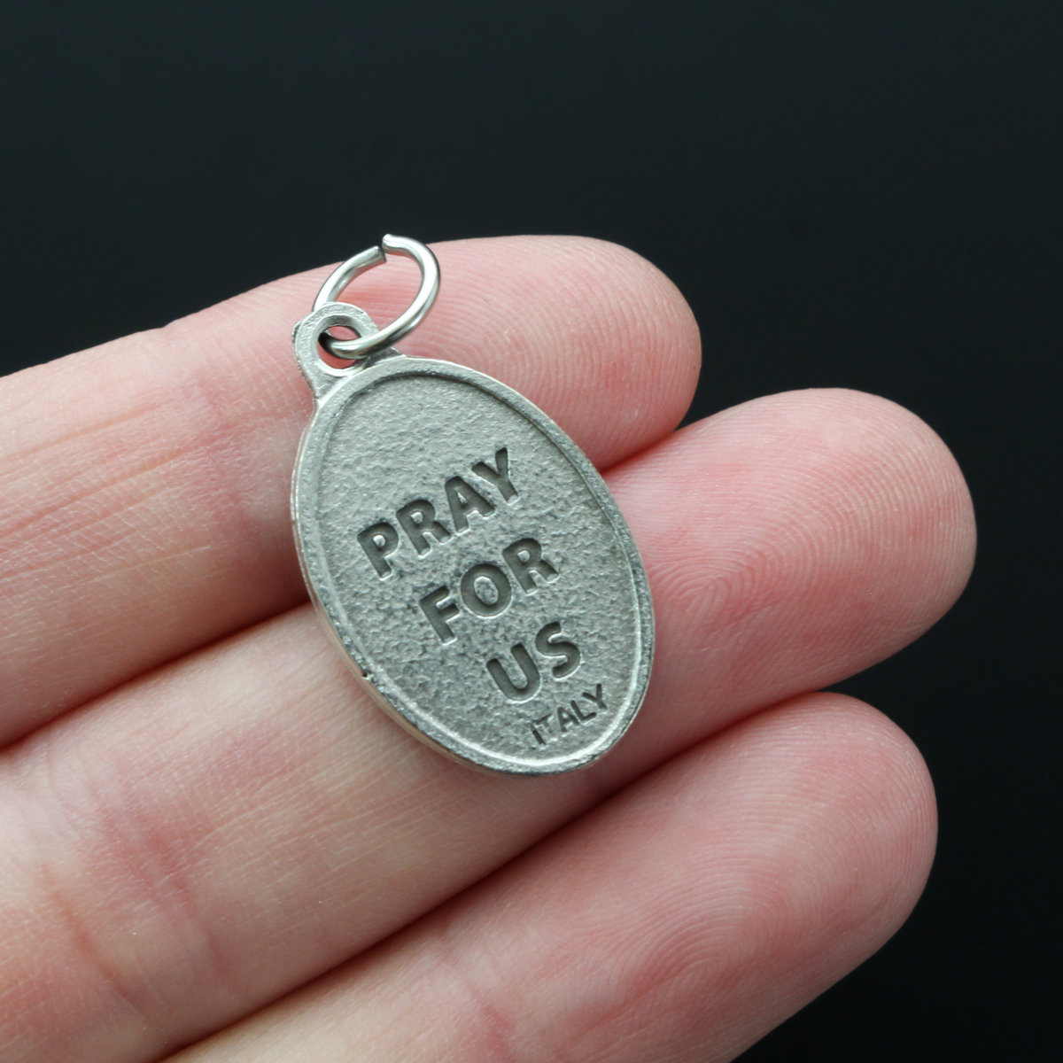 Saint Lazarus of Bethany oval medal that depicts the saint on the front and "Pray For Us" on the back.