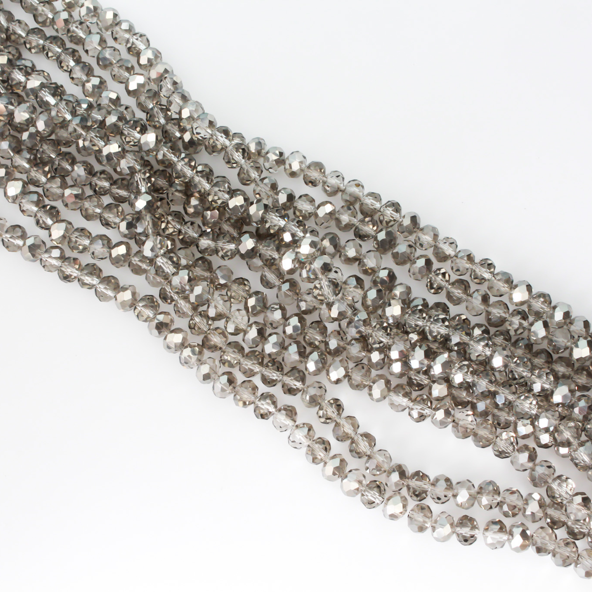 Light gray electroplate glass beads with a pearl luster plating. Rondelle in shape with a faceted design, 8x6mm