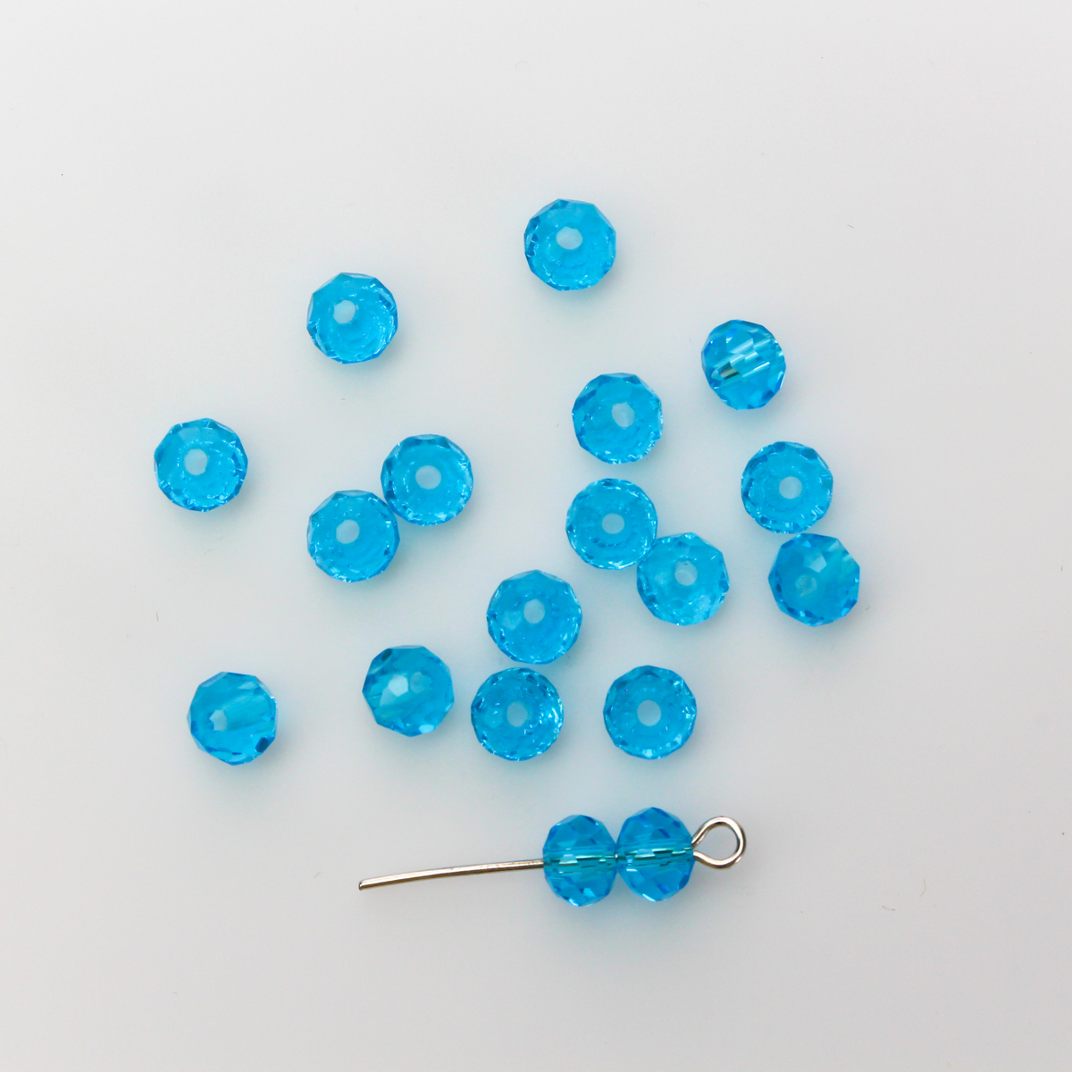 Asian cut crystal glass beads. 6mm x 4mm faceted light blue transparent. Sold in packages of 60 beads