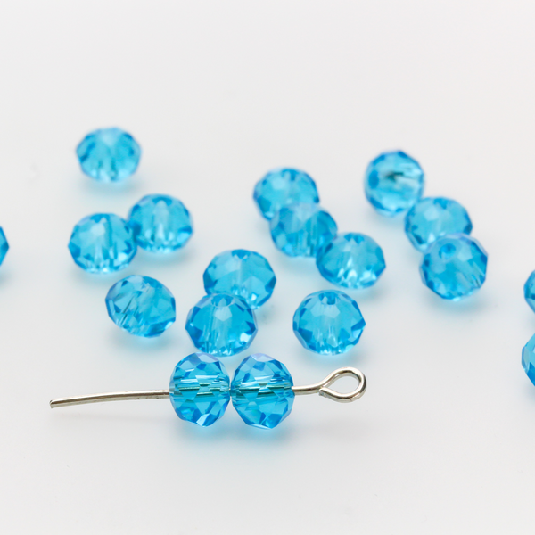Asian cut crystal glass beads. 6mm x 4mm faceted light blue transparent. Sold in packages of 60 beads