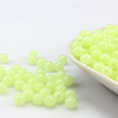 luminous glow in the dark round acrylic beads that are center drilled