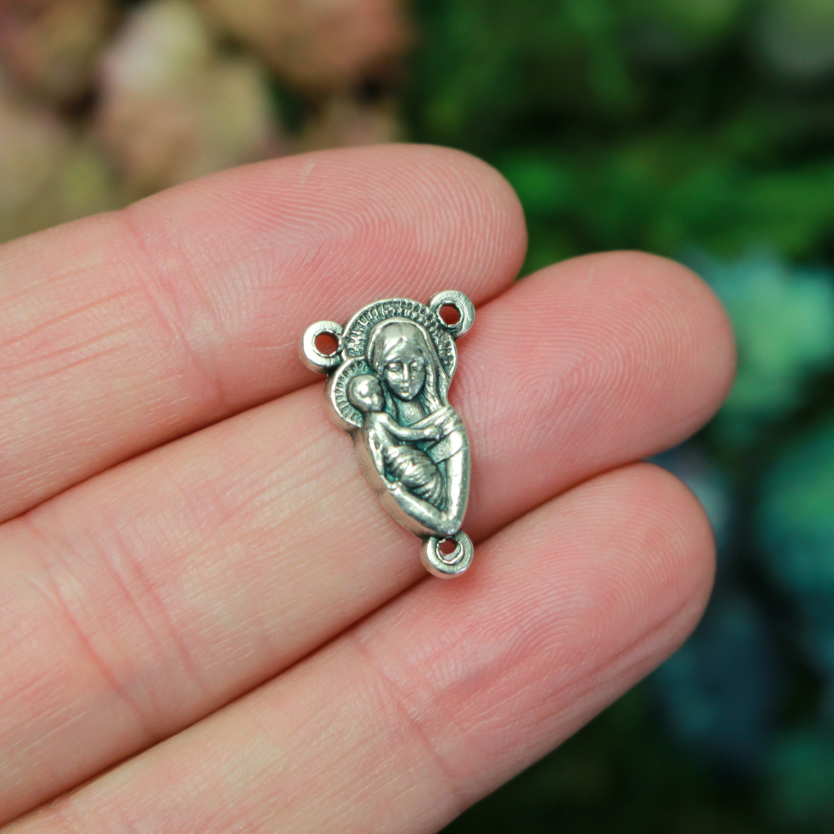 This small but beautifully detailed center features an embossed image of our Mother Mary and the Child Jesus on the front, and an embossed image of the Sacred Heart of Jesus on the reverse