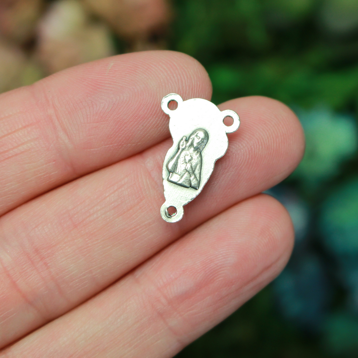 This small but beautifully detailed center features an embossed image of our Mother Mary and the Child Jesus on the front, and an embossed image of the Sacred Heart of Jesus on the reverse