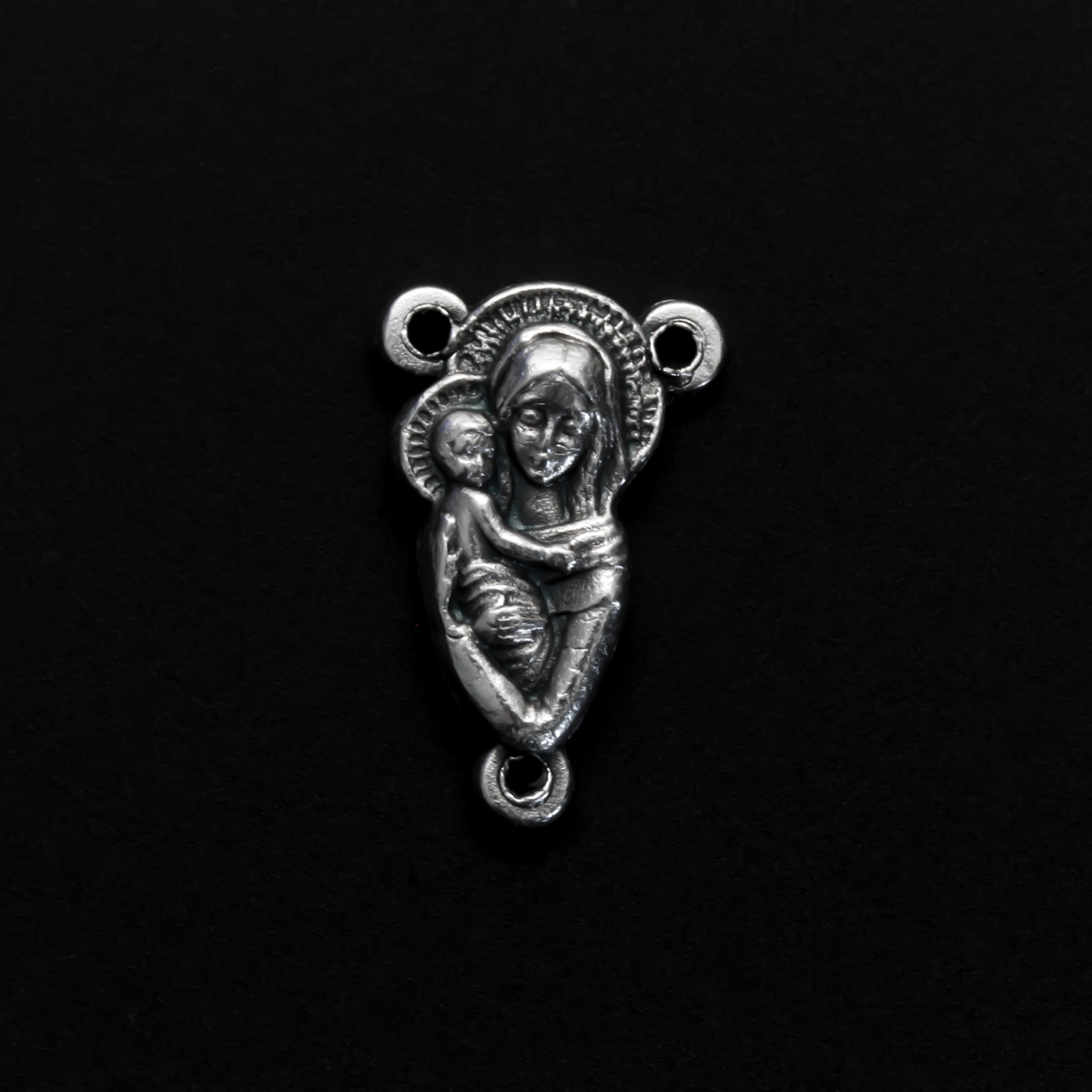 This small but beautifully detailed center features an embossed image of our Mother Mary and the Child Jesus on the front, and an embossed image of the Sacred Heart of Jesus on the reverse