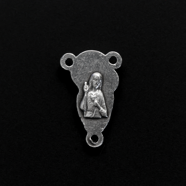 This small but beautifully detailed center features an embossed image of our Mother Mary and the Child Jesus on the front, and an embossed image of the Sacred Heart of Jesus on the reverse
