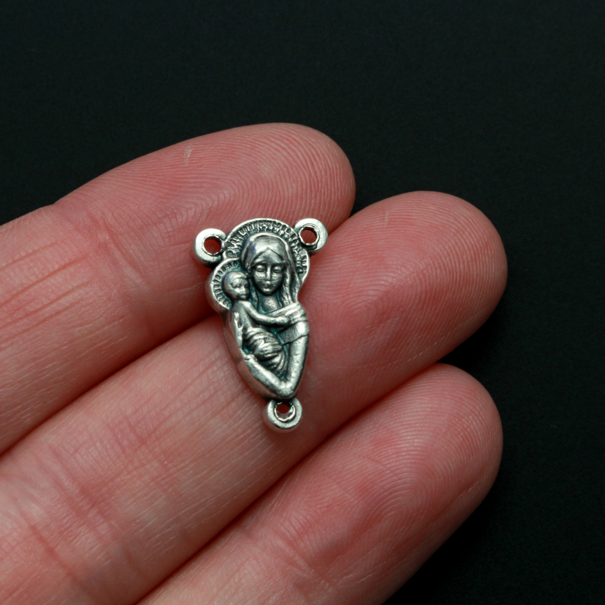 This small but beautifully detailed center features an embossed image of our Mother Mary and the Child Jesus on the front, and an embossed image of the Sacred Heart of Jesus on the reverse