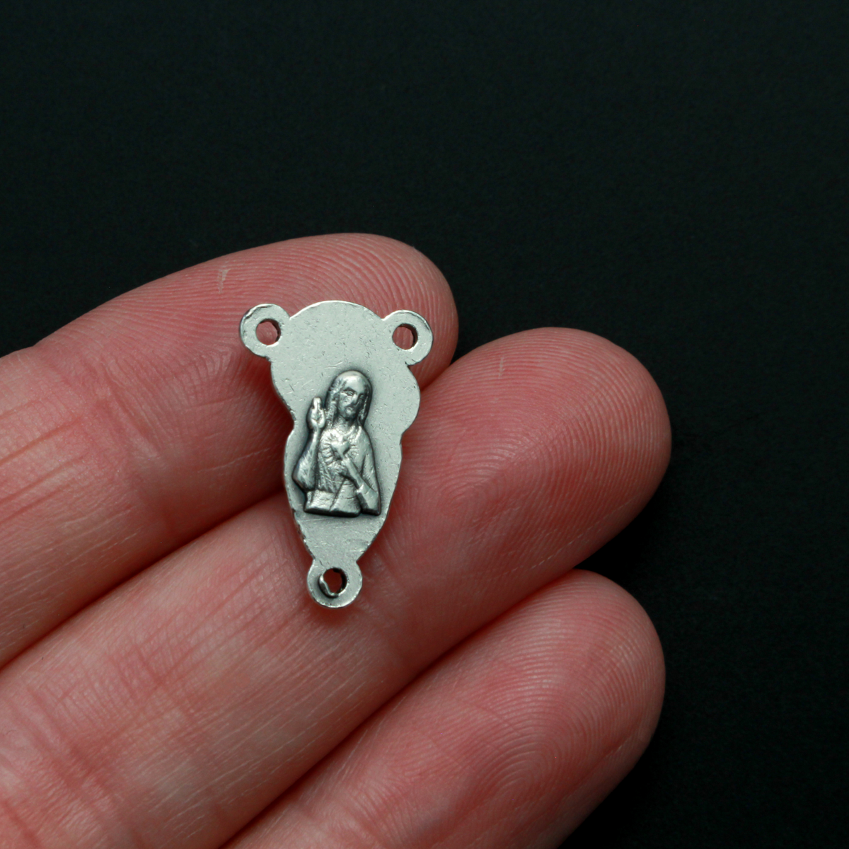 This small but beautifully detailed center features an embossed image of our Mother Mary and the Child Jesus on the front, and an embossed image of the Sacred Heart of Jesus on the reverse