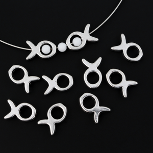 Silver tone bead frames that are shaped like a fish. They fit beads 4mm or smaller 