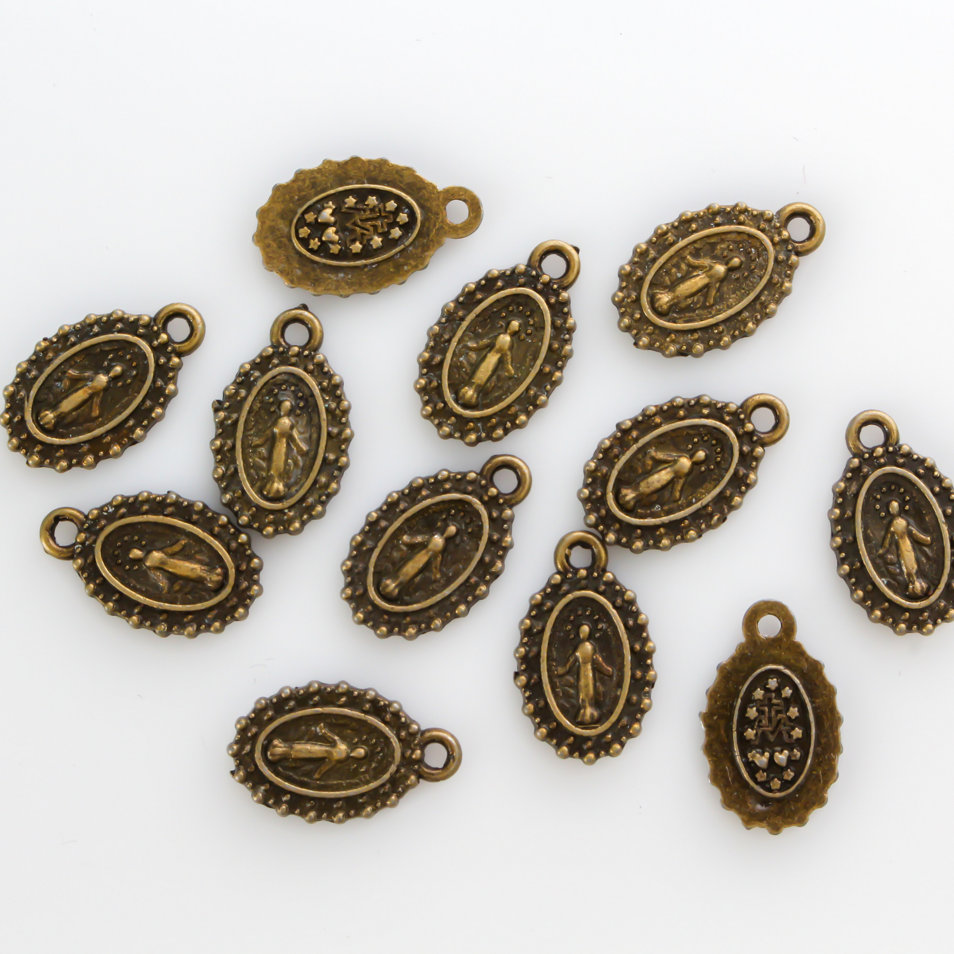 Small bracelet size bronze Miraculous medal charms with a dotted border 15mm long