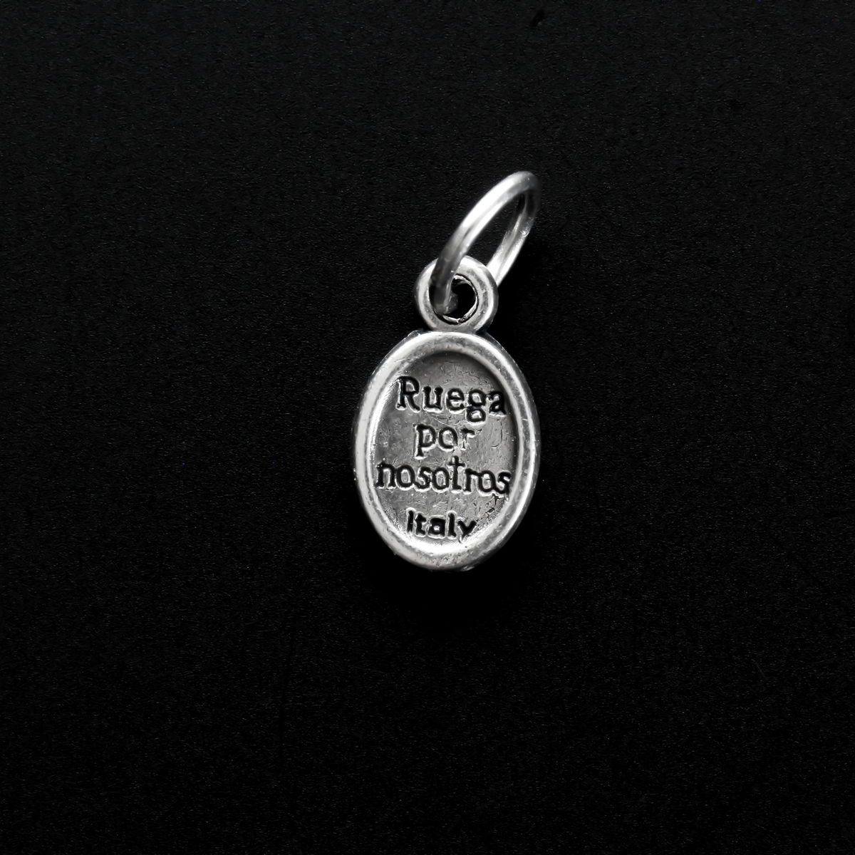 Tiny Divine Mercy of Jesus medal with "Pray For Us" written in Spanish on the backside: Ruega Por Nosotros.