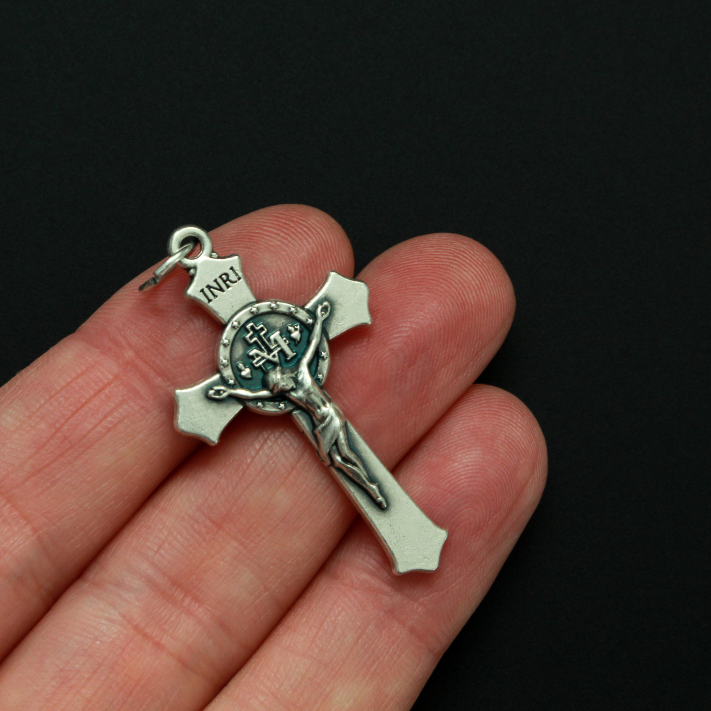 detailed Miraculous Medal crucifix that features flared edges and a detailed Miraculous Medal