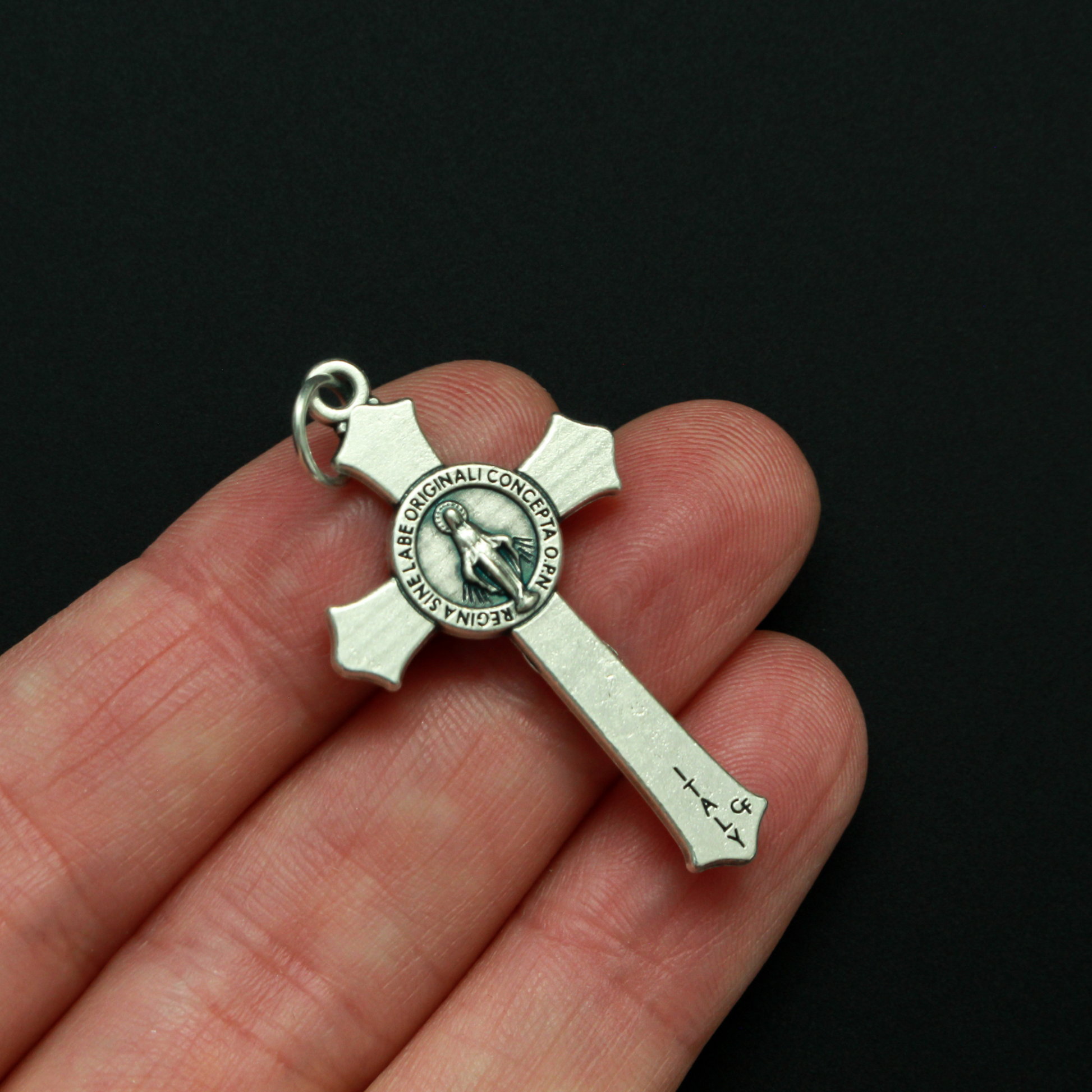 detailed Miraculous Medal crucifix that features flared edges and a detailed Miraculous Medal