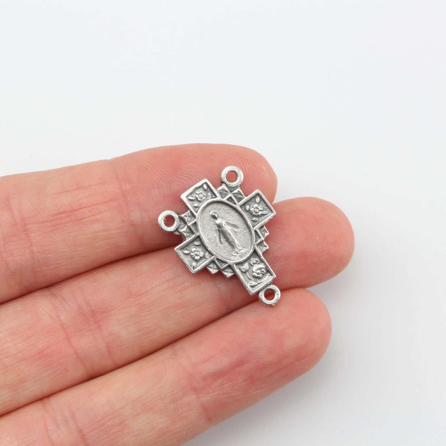 Miraculous Medal Rosary Centerpiece in a Cross Shape detailed with Flowers