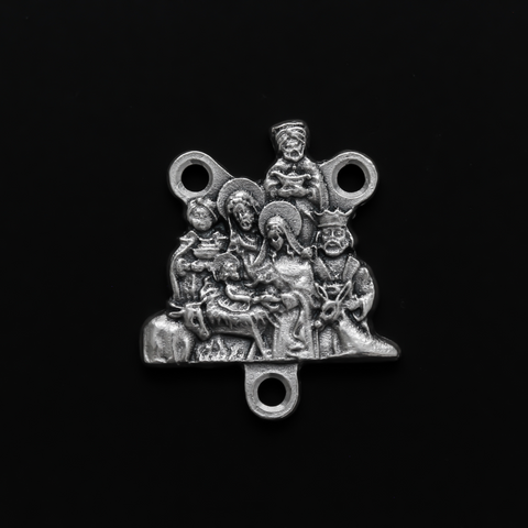 Silver tone Nativity rosary centerpiece that depicts Joseph, Mary, Jesus and the three wise men