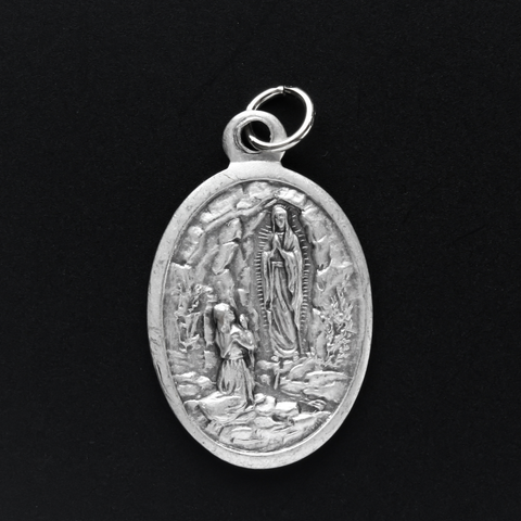 our lady of lourdes silver oxidized one inch oval medal handcrafted in italy