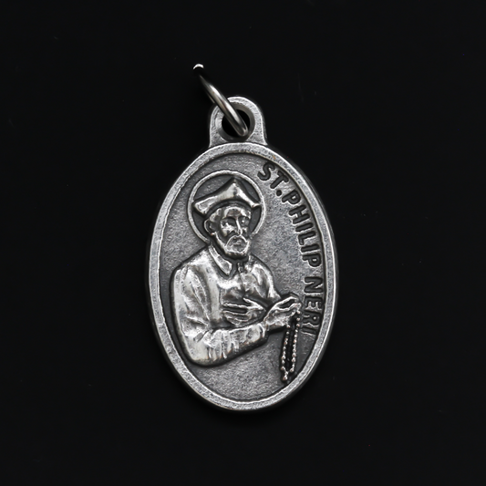 1" oval silver oxidized St. Philip Neri medal that depicts the saint on the front and Pray For Us on the back