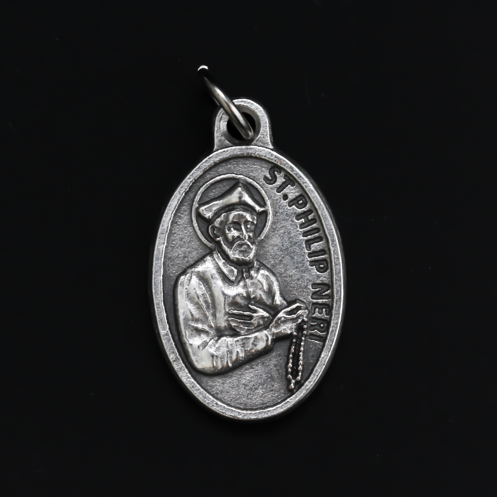 1" oval silver oxidized St. Philip Neri medal that depicts the saint on the front and Pray For Us on the back